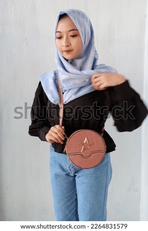 Portrait of Happy Face Asian Woman Model Hold A Bag