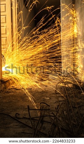 Long Exposure Photography Of Light Trails Caused By The Cutting Of Metal During Construction.