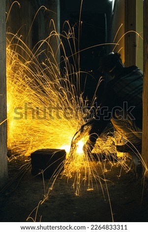Long Exposure Photography Of Light Trails Caused By The Cutting Of Metal During Construction.