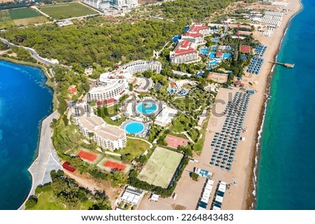 Sorgun. Side. The resort village of Titreyengol on the shores of a trembling lake in Turkey. There are many four and five star hotels around the lake. Beach and Mediterranean Sea. Drone shooting Royalty-Free Stock Photo #2264843483