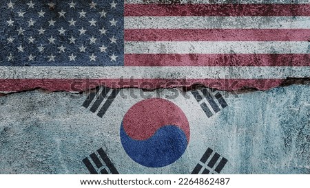 United States and South Korea flag on cracked wall background. Economics, politics conflicts, war concept texture background
