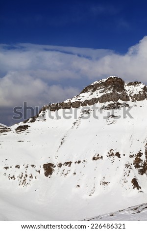 Snowy rocks in nice sun day. Caucasus Mountains, Georgia, ski resort Gudauri.