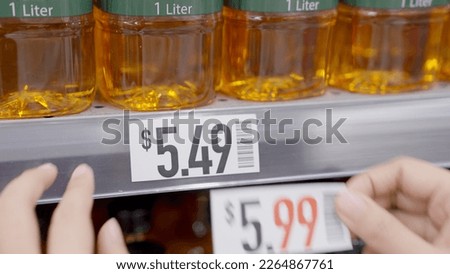 Rising prices cost of living interest rate tax raise crisis concept. Global CPI index data number surge up high in grocer market by cooking oil food supply chain issues at retail store grocery mall. Royalty-Free Stock Photo #2264867761