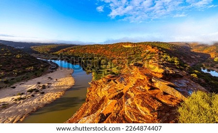 panorama of murchison river gorge in kalbarri national park during sunrise, western australia; desert landscape with red rocks and a river in a deep gorge near nature's window	 Royalty-Free Stock Photo #2264874407