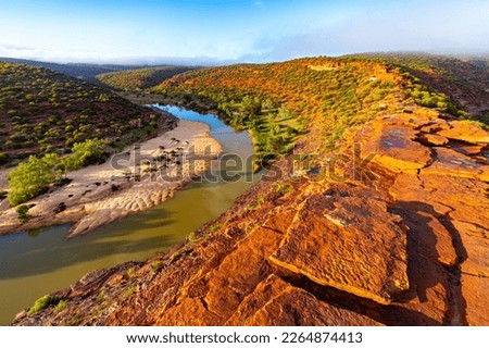 panorama of murchison river gorge in kalbarri national park during sunrise, western australia; desert landscape with red rocks and a river in a deep gorge near nature's window	 Royalty-Free Stock Photo #2264874413