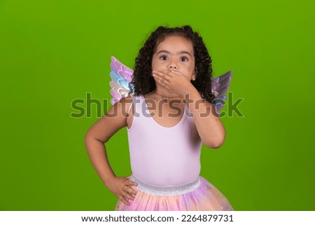 Cute little girl in unicorn costume happy on children's day.