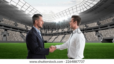 Composition of two businessmen shaking hands over sports stadium. sport and competition, business and finance concept digitally generated image.