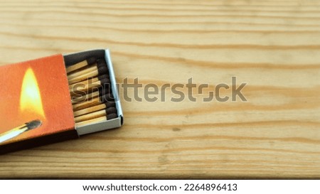 Wooden match sticks isolated on wooden table.