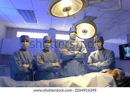 Operating surgery room Doctor or Surgeon, Medical Team Performing Surgical Operation in Modern Operating Room.