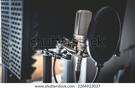 Professional microphone in recording studio for music creation closeup. Mic for rock and pop vocal presentation