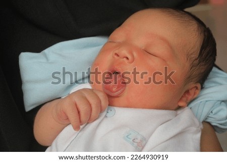 cute and sweet baby, sleeping sucking hand