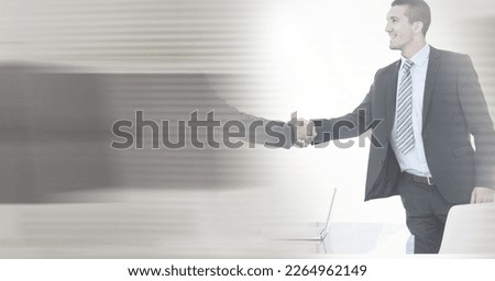 Composition of two happy diverse businesspeople shaking hands with motion blur. global business, partnership and success concept digitally generated image.