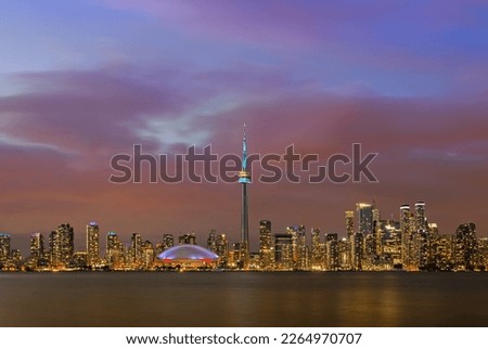 Panoramic of Toronto Downtown illuminated cityscape over Ontario Lake at twilight, Toronto, Canada