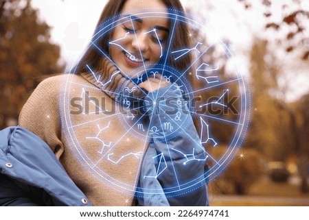Beautiful young woman outdoors and zodiac wheel illustration Royalty-Free Stock Photo #2264974741