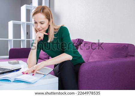 Business woman works in the office. Iindependent lady who studies from a distance. Learning at home.
