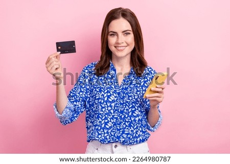 Photo of young promoter business lady brown hair hold her smartphone with black plastic premium wireless payment isolated on pink color background