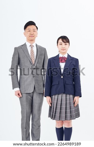 A man in a suit and a high school girl