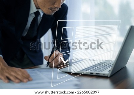 Businessman using Electronic smart checklist and document on virtual screens concept, business people check electronic documents on digital documents, paperless offices,