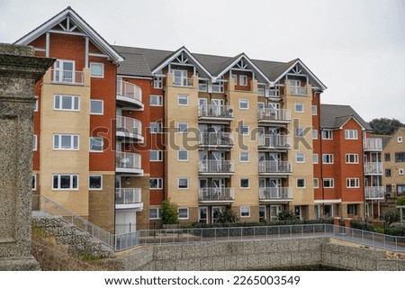 Retirement apartments in city. purpose built block of flats with communal garden Royalty-Free Stock Photo #2265003549