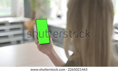 Blonde Young Woman Using Smartphone with Green Screen