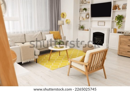 Spring atmosphere. Stylish room interior with cozy furniture in yellow and white colors Royalty-Free Stock Photo #2265025745