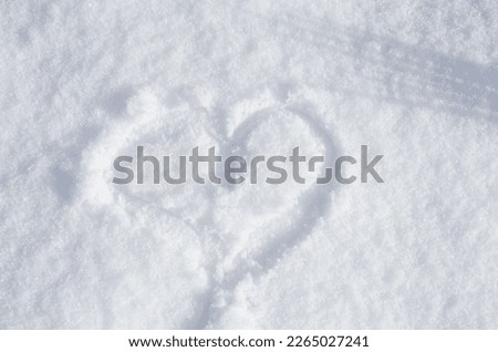 Drawn heart on the snow. Winter snowy February in Kramatorsk.
Romantic snowy day.