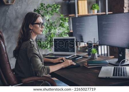 Profile side photo of clever serious woman boss it company hacking sites earn money develop skills sitting indoor room workstation