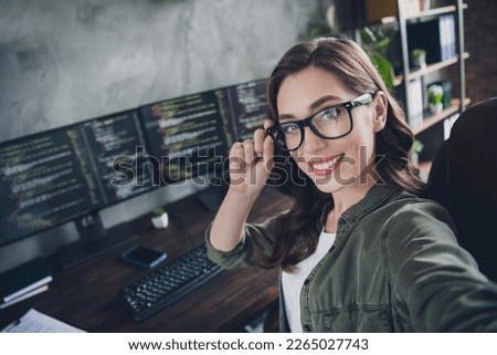Photo of smart positive manager lady sitting chair arm touch eyewear make selfie workstation indoors