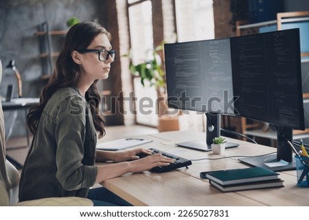 Photo of busy serious lady content manager wear eyeglasses testing secure system indoors workplace workstation