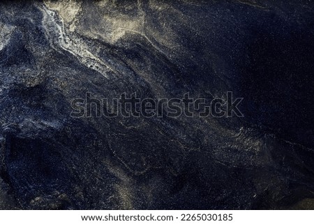 Luxury abstract background, liquid art. Black gold paint mix, alcohol ink blots, marble texture. Modern print pattern Royalty-Free Stock Photo #2265030185