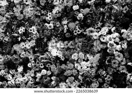 Artificial flowers decoration - floral ornamental composition. Black and white photo retro style.