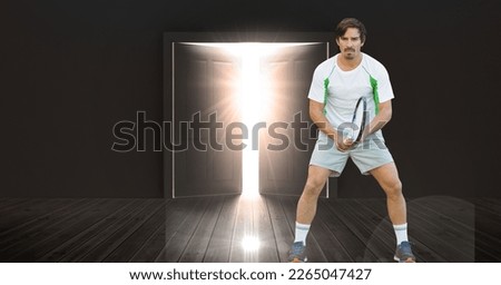 Composition of male tennis player holding tennis racket with light shining through door. sport, fitness and active lifestyle concept digitally generated image.