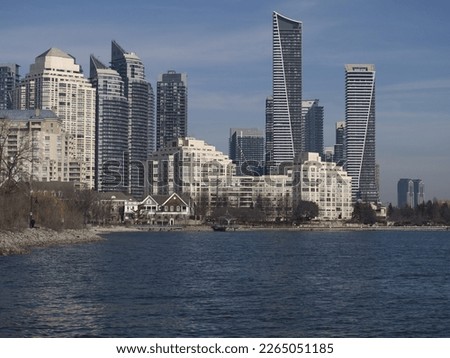 Panorama of the city near the lake in blue shades