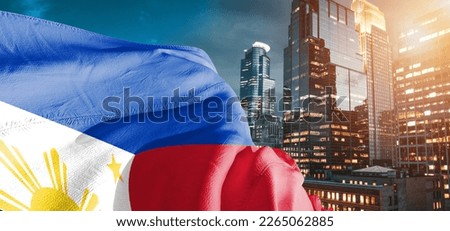 Philippines national flag cloth fabric waving on beautiful buildings background. Royalty-Free Stock Photo #2265062885