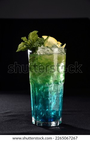Iced drink with citrus fruits lemon orange alcoholic cocktail martini vodka margerita run tropical fruit juice