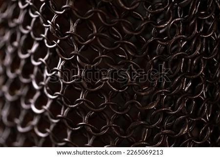 Metal chain mail made of rings, close-up. Protection for the knight. Royalty-Free Stock Photo #2265069213