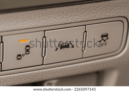 Modern car lane keeping assist system switch button. Track assistant of a modern car. Royalty-Free Stock Photo #2265097143