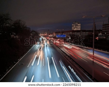 City motorway A100 in rush hour in the evening with lights and moving traffic