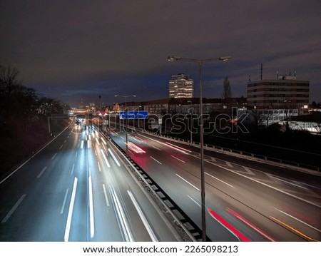 City motorway A100 in rush hour in the evening with lights and moving traffic