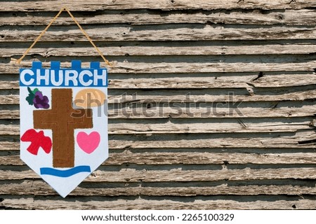 Horizontal shot of a Church Banner announcements on the left side with wooden background effect.  Lots of copy space.