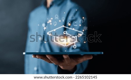 E-learning online education course degree certificate, Man using computer holding lightbulb with learning educate and graduation study knowledge to creative thinking idea and problem solving solution Royalty-Free Stock Photo #2265102145