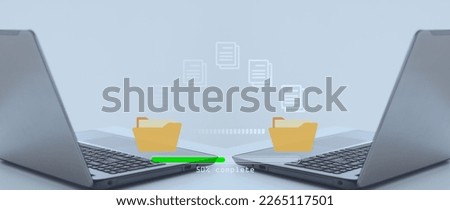 Data transfer concept.  Transfer files of data between folders on computer laptops, Copy files, Backup data, Exchange of file on folder, DMS. Virtual document loading to another folder. Royalty-Free Stock Photo #2265117501