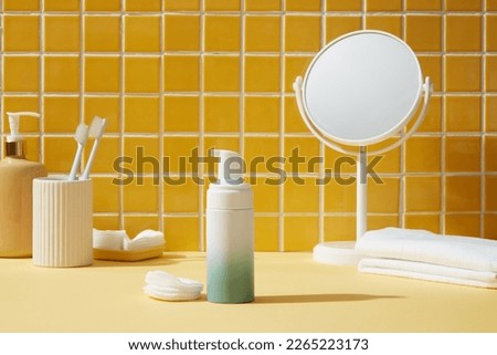 Some white stuffs with an empty label bottle over minimalist and clean bathroom background