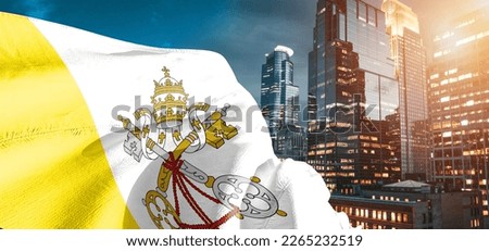 Vatican City national flag cloth fabric waving on beautiful buildings background.