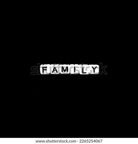 family word in black background. concept of love and family