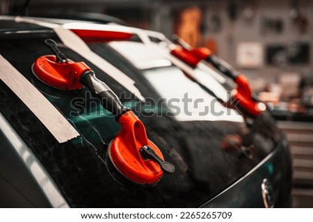 Mechanic car service changing windshield mirror by used technology replacing new windscreen