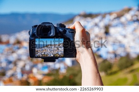 smartphone with Chefchaouen photography,  Morocco