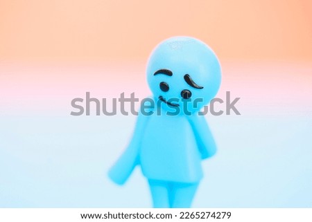 Colorful dolls with sad expressions