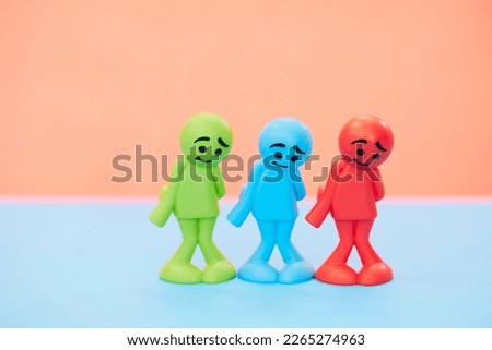 Colorful dolls with sad expressions