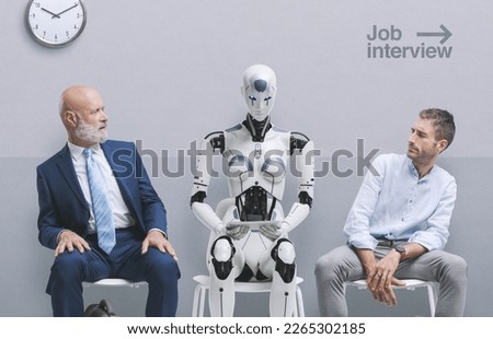 Disappointed job applicants sitting in the waiting room and staring at the AI robot candidate, they are waiting for the job interview Royalty-Free Stock Photo #2265302185